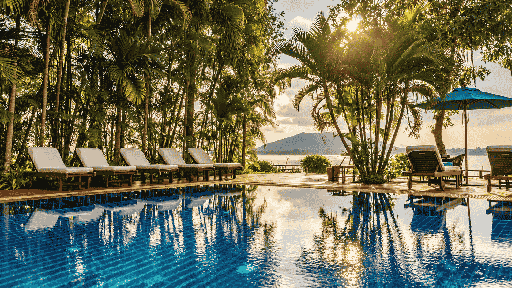 Palms, blue water and the Mekong beyond the lodge pool.